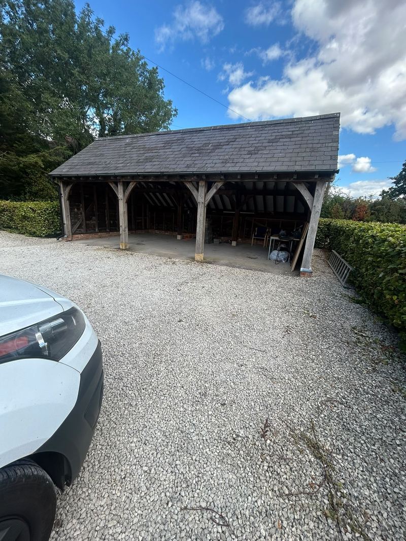 Before: the open oak-framed carport in Hatton